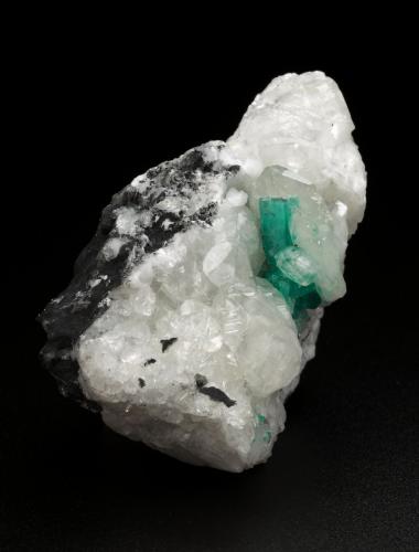 Beryl (variety emerald), Calcite<br />Muzo mining district, Western Emerald Belt, Boyacá Department, Colombia<br />45x47x32mm, xl=15mm<br /> (Author: Fiebre Verde)