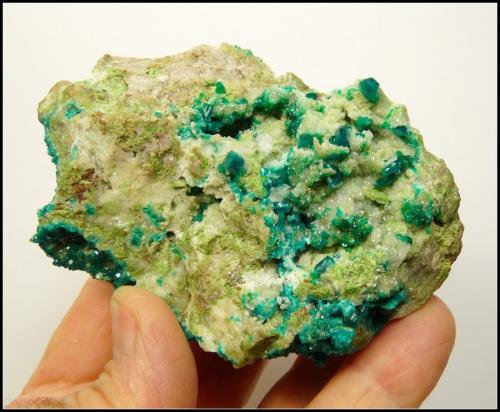 Dioptase and calcite<br />Tsumeb Mine, Tsumeb, Otjikoto Region, Namibia<br />91 x 63 x 36 mm<br /> (Author: Pierre Joubert)