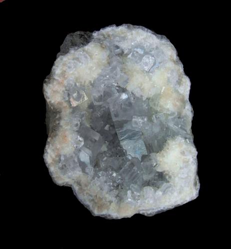 Celestina y calcita<br />Yacimiento de celestinas, Langre, Ribamontán al Mar, Comarca Trasmiera, Cantabria, España<br />6.1x4.7cm y cristal mayor biterminado de 2.3 cm de arista<br /> (Autor: DAni)