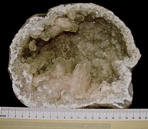 Calcite (variety manganese-rich) on Quartz<br />Sheffler's Geode Mine, St. Francisville, Clark County, Missouri, USA<br />large geode about 18 cm. The calcites are up to about 4.5 cm<br /> (Author: Bob Harman)