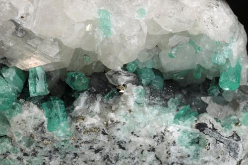Beryl (variety emerald), Calcite, Pyrite<br />Coscuez (distrito minero), Municipio San Pablo de Borbur, Cinturón Esmeraldífero Occidental, Departamento Boyacá, Colombia<br />122x65x48mm, xls up to 8mm<br /> (Author: Fiebre Verde)