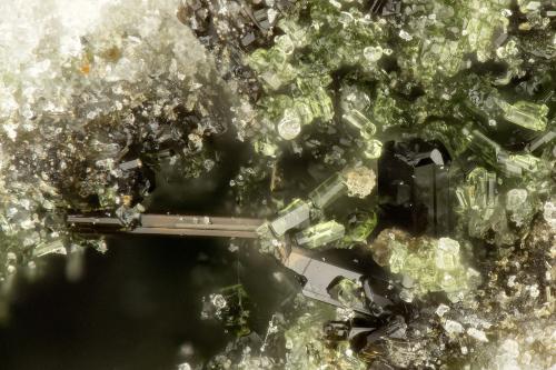 Epidote, Aenigmatite<br />Taratimi Bay (Crater Bay), Mayor Island (Tuhua), New Zealand<br />FOV = 0.9 mm<br /> (Author: Doug)