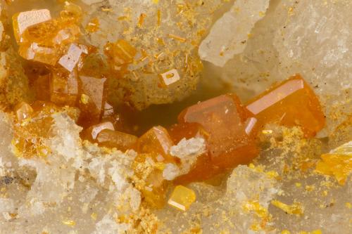 Wulfenite, Vanadinite<br />Shelby Mine, White Hills, Cerbat Mountains, Gold Basin District, Mohave County, Arizona, USA<br />FOV = 2.1 mm<br /> (Author: Doug)