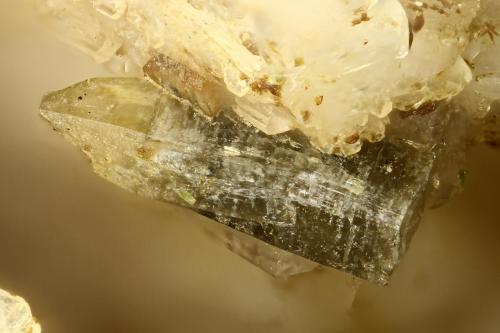 Gadolinite-(Y)<br />Washington Pass, Golden Horn Batholith, Okanogan County, Washington, USA<br />FOV = 2.0 mm<br /> (Author: Doug)