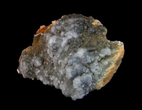 Vanadinita recubierta de Calcita<br />Laura Claim, Los Lastonares, Albuñuelas, Comarca Valle de Lecrín, Granada, Andalusia, Spain<br />7,2x6cm. Botroides de 8mm.<br /> (Autor: DAni)