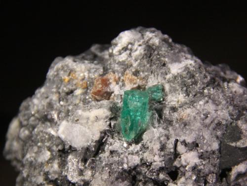 Beryl (variety emerald), Parisite and Calcite<br />Muzo mining district, Western Emerald Belt, Boyacá Department, Colombia<br />45mm x 42mm x 36mm<br /> (Author: Firmo Espinar)