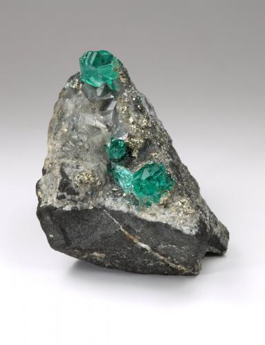 Beryl (variety emerald), Pyrite, Calcite<br />Chivor mining district, Municipio Chivor, Eastern Emerald Belt, Boyacá Department, Colombia<br />36mm x 45mm x 37mm, xls=13 & 5mm<br /> (Author: Fiebre Verde)