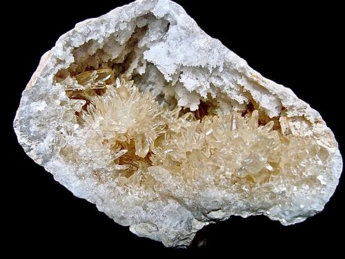 Calcite on Quartz<br />Lawrence County, Indiana, USA<br />Calcites to 2 cm in 6.5 cm geode<br /> (Author: Bob Harman)