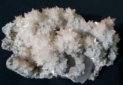 Calcite on Quartz (variety smoky)<br />Daye mining area, Edong, Daye, Huangshi Prefecture, Hubei Province, China<br />16 x 10 cm<br /> (Author: Volkmar Stingl)