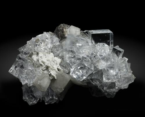 Fluorite with Calcite and Dolomite<br />Emilio Mine, Obdulia vein, Caravia mining area, La Rubiera, Loroñe, Colunga, Comarca de la Sidra, Principality of Asturias (Asturias), Spain<br />Specimen size: 9.6 × 7.4 × 4.7 cm / main crystal size: 1.6 × 1.5 cm<br /> (Author: Jordi Fabre)