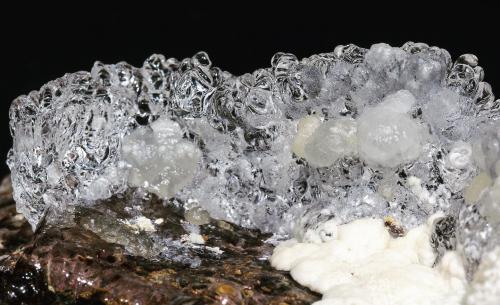 Opal (variety hyalite) with Aragonite<br />Tarcal, Eperjes-Tokaj Mountains, Borsod-Abaúj-Zemplén, Hungary<br />Specimen size: 6.6 × 3.6 × 3.8 cm<br /> (Author: Jordi Fabre)