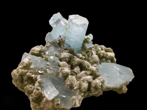 Beryl (variety aquamarine) on Muscovite and Albite<br />Nagar, Hunza Valley, Nagar District, Gilgit-Baltistan (Northern Areas), Pakistan<br />13 X 10 cm, biggest crystal 4.5 cm<br /> (Author: Jean Suffert)