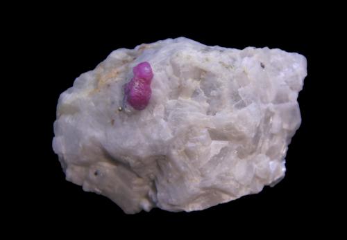 Corundum (variety ruby)<br />Ali Abad, Hunza Valley, Nagar District, Gilgit-Baltistan (Northern Areas), Pakistan<br />57mm x 42mm x 32mm<br /> (Author: Firmo Espinar)