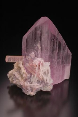 Spodumene var. Kunzite with 
Elbaite (Tourmaline) and Albite.
Laghman Prov., Afghanistan
9.8 x 10.3 x 5.7 cm (Author: Gail)