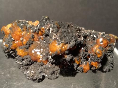 Mimetite (variety campylite), Romanèchite<br />Dry Gill Mine, Caldbeck Fells, Allerdale, former Cumberland, Cumbria, England / United Kingdom<br />56 x 38 mm<br /> (Author: Sante Celiberti)