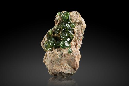 Andradite (variety demantoid)<br />Ambanja District, Antsiranana Province, Madagascar<br />8 x 8 x 11 cm / main crystal: 2 cm<br /> (Author: MIM Museum)