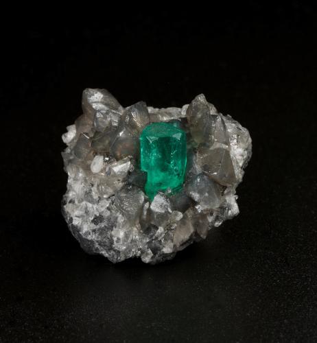 Beryl (variety emerald), Calcite, Dolomite<br />La Pita mining district, Cunas Mine, Municipio Maripí, Western Emerald Belt, Boyacá Department, Colombia<br />24 x 18 x 24 mm, xl=9 x 5 mm<br /> (Author: Fiebre Verde)