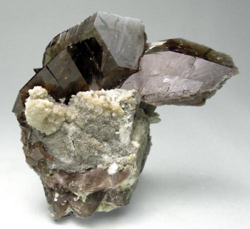 Axinite, calcite
Puiva Mount, Saranpaul, Prepolar Ural, Tyumenskaya Oblast’, Urals Region, Russia
37 mm × 32 mm

Also published at "Fabre Minerals Reference Specimens - The Silvane Collection" http://www.fabreminerals.com/specimens/RSSLV-silvane-notable-specimens.php#AF96M4 (Author: Carles Millan)