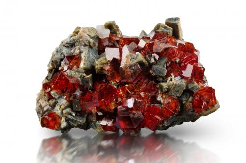 Grossular (variety hessonite)<br />Belvidere Mountain Quarries, Lowell & Eden, Orleans and Lamoille Counties, Vermont, USA<br />6 x 5 x 8.5 cm / main crystal: 1.6 cm<br /> (Author: MIM Museum)