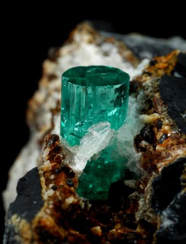 Beryl (variety emerald), Calcite, Pyrite, Goethite<br />Chivor Mining District, Camoyo Mine, Municipio Chivor, Eastern Emerald Belt, Boyacá Department, Colombia<br />77 x 65 x 42 mm, xl=14 x 8 mm<br /> (Author: Fiebre Verde)