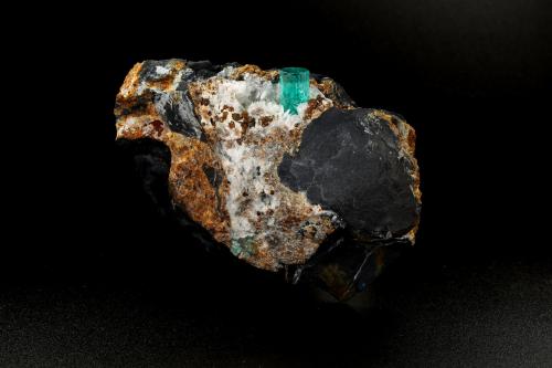 Beryl (variety emerald), Calcite, Pyrite, Goethite<br />Chivor Mining District, Camoyo Mine, Municipio Chivor, Eastern Emerald Belt, Boyacá Department, Colombia<br />77 x 65 x 42 mm, xl=14 x 8 mm<br /> (Author: Fiebre Verde)