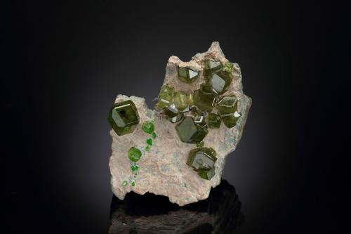 Andradite (variety demantoid)<br />Sferlùn asbestos Mine, Vallone del Cengiaccio, Lanzada, Malenco Valley (Valmalenco), Sondrio Province, Lombardy, Italy<br />7.5 x 6 x 4.5 cm / main crystal: 1.6 cm<br /> (Author: MIM Museum)