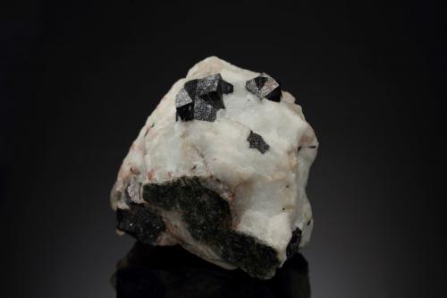 Loparite-(Ce)<br />Khibiny Massif, Kola Peninsula, Murmanskaja Oblast, Northern Region, Russia<br />3 x 2.5 x 3 cm / main crystal: 0.9 cm<br /> (Author: MIM Museum)