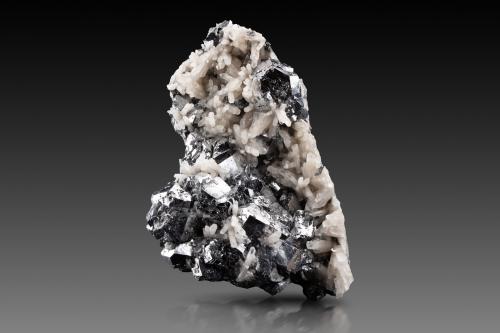 Skutterudite<br />Bou Azzer Mines, Bou Azzer mining district, Ouarzazate Province, Drâa-Tafilalet Region, Morocco<br />11 x 6.5 x 16.5 cm / main crystal: 3.4 cm<br /> (Author: MIM Museum)