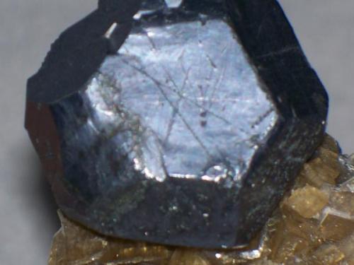 Here’s a photo showing the damage up close and personal.  I like to think that a famous German mineralogist scratched the face and then blow-piped it (yes, look at the lower left quadrant of the spinel-twinned crystal.  I DON’T CARE. Yes, it’s unfortunate that it has been damaged, but hey, now I can make up a story to go with the damage.  And I have a way to show how a blowpipe affects galena. Bottom line, I like it, I bought it for my own enjoyment, and I do not consider it to be an "investment". (Author: Ed Huskinson)