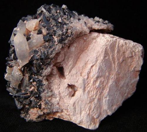 Schorl on clear Quartz to 1.5 cm. on Feldspar. 
Klein Spitzkoppe, Erongo Region, Namibia.
5.5 x 5 x 4cm
Crystals of Schorl to 1.1cm (Author: Debbie Woolf)