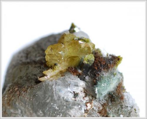 Titanite on Calcite with Epidote and Byssolith (Author: jaysminerals)