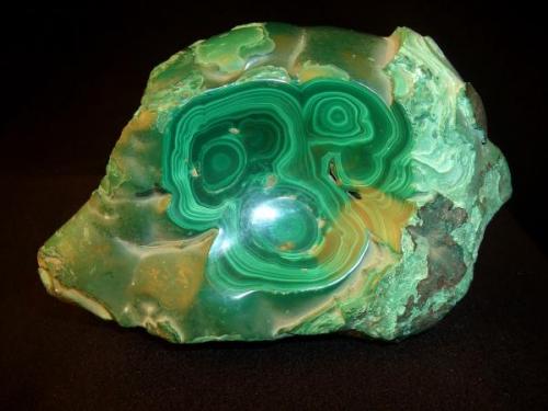My first Malachite. I have to agree with Jordi on the sacredness of leaving a mineral in its natural form. This is not what I had ordered, the dealer was helping. Still it has the habit I am most enamored with, and kids think its pretty. It is 5" x 3 1/2 x 2" (12.7cm x 8.9cm x 5.1cm) (Author: Jim Prentiss)