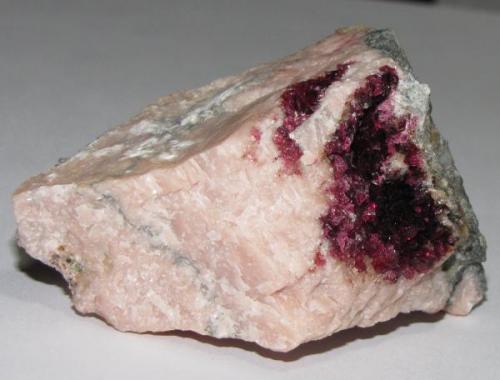 Roselite on pink calcite from Bou Azzer area, near Ouarzazate, Morrocco.  6.1 x 4.3 x 3.6 specimen.  From the 2009 Munich show. (Author: Tracy)