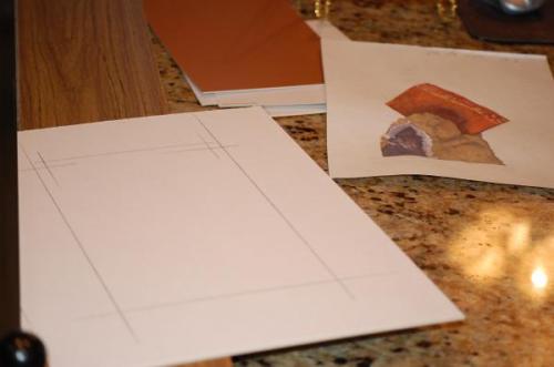 Laying out a design on the back of the matboard. All mats are cut from the back. (Author: Gail)