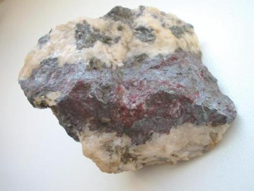 Massive pyrargyrite ("Rotgültig") in dolomite/fluorite matrix from König David mine, Annaberg district, Erzgebirge, Saxony. 6,5 cm sample. (Author: Andreas Gerstenberg)