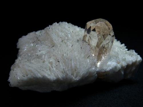 This specimen consists of a matrix of snowy white cleavelandite  and a single, perfectly formed peach topaz. Pakistan,  Northern Areas, Skardu, Yunu, Shigar Valley

Size 80 x 52 x 40 mm (Author: olelukoe)