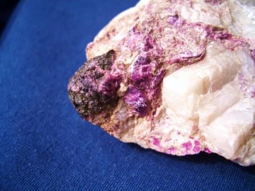 Clinochlore (var. Chromian Clinochlore). I tossed this one in for color. These bright lilac, tiny hexagonal crystal clusters come from the Woods Chromite Mine, Lancaster, Pennsylvania. The specimen is about 2" (5.08cm) across. (Author: Jim Prentiss)