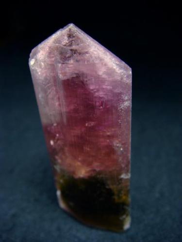 Bright colored, polychromic tourmaline crystal with perfect termination, from Malkhan Pegmatite field, Mokhovaya vien.

Size 50 x 18 x 15 mm (Author: olelukoe)