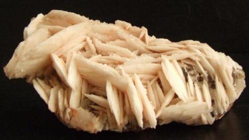 Baryte Taffs Well Quarry, Mid Glamorgan, Wales.7.5 x 3.5 x 3.5 cms, this piece is encrusted with tiny clear sharp Calcite crystals. (Author: nurbo)
