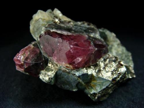 Large (22mm), red spinel crystal and one crystal smaller behind it in matrix rock, from Gem spinel deposit, Kuhi-lal, Pyandzh River Valley, Pamir Mts, Viloyati Mukhtori Gorno-Badakhshan, Tajikistan

Size 55 x 38 x 18 mm (Author: olelukoe)