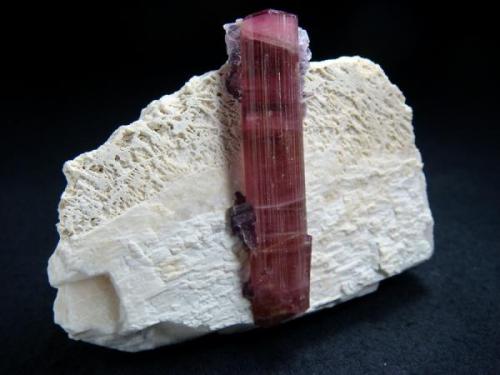 Perfect tourmaline crystal, that sitting on matrix rock, from Himalaya Mine (Himalaya pegmatite; Himalaya dikes), Gem Hill, Mesa Grande District, San Diego Co., California, USA

Size 75 x 43 x 57 mm (Author: olelukoe)