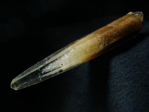 Quartz crystal with actinolite needles phantom inside, from Ganesh Himal (Ganesha), Himalayan Mts, Dhading District, Bagmati Zone, Nepal

Size 87 x 16 x 17 mm (Author: olelukoe)