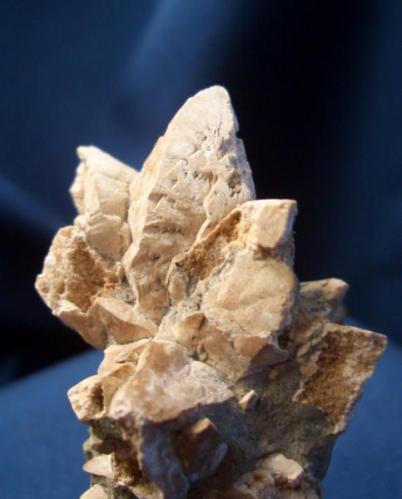 This is a busy little piece. It took nearly fifteen years to get the whole story from the Alaska Geological Survey, on this ugly little specimen. It is Calcite var. Glendonite pseudomrph after sand included Glauberite. I picked it up Near Carter Creek, North Slope, Alaska, while crewing a helicopter in 1983. It is 2 1/2" x 1 5/8" (6.35cm x 4.13cm) (Author: Jim Prentiss)