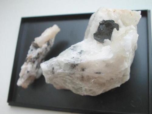 Grey platy stibiopearceite crystal (now you call this mineral polybasite-tac...) on baryte vug from the Clara mine, Oberwolfach, Black Forest. The crystal measures 15 x 12 mm. (Author: Andreas Gerstenberg)