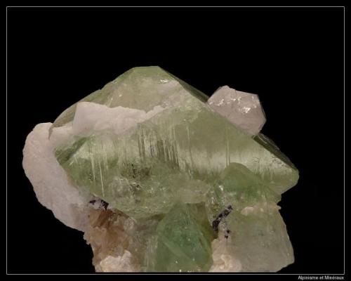 Herderite 
Shigar, Pakistan
fov 4 cm

Interessant with quartz on green cristal (Author: ploum)