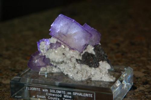 This is a light purlple cluster of fluorties on dolomite matrix with scattered sphalerite from the Elmwood Mine, TN.   This measures 10 x 9 x 6 cm and weighs 150 grams. (Author: VRigatti)