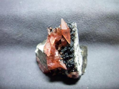 Rhodochrosite
from Uchucchacua Mine, Peru
size: less than 2x2x2 cubic inch.
This specimen isn’t with me now.it has been in my home town since last christmax.but I keep the picture .there is a double terminated Rhodochrosite crystal on matrix (Author: pro_duo)