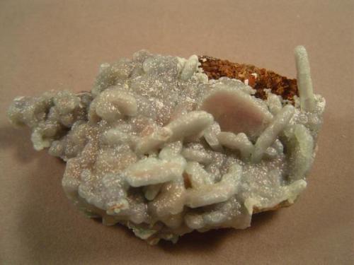 Smithsonite on barite.  Juanita Tunnel, (Kelly Mine), Magdalena District, Socorro County, New Mexico. 8.5 X 5 cm. When I first found the barite there I thought it was wulfenite. These smithsonite-coated specimens assuaged my disappointment.. (Author: Ed Huskinson)