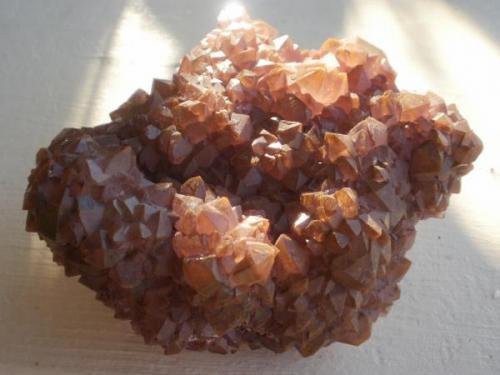 Quartz on Barite, Palm Park, Dona Ana County, NM. The matrix is bladed greenish-brown barite. 10 cm. (Author: Darren)