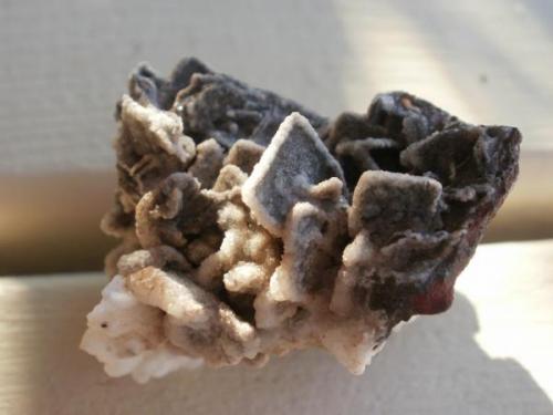 One of my favorites! Calcite after Wulfenite, Stephenson-Bennett Mine, Dona Ana County, NM. About 4 cm. Collected from the dumps in 2002. (Author: Darren)